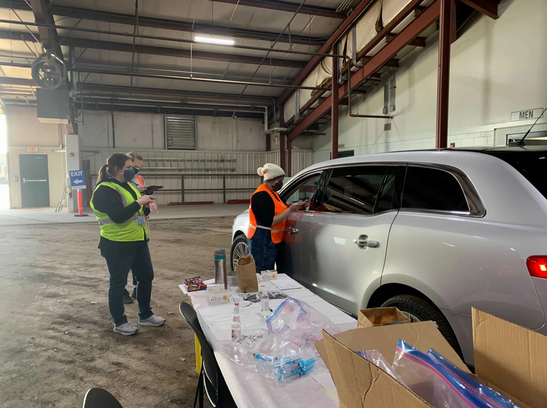 Patients arrived to the drive-thru clinic at their allotted time and were given the vaccine in their car before being monitored for adverse side effects in a separate building for 15 minutes.