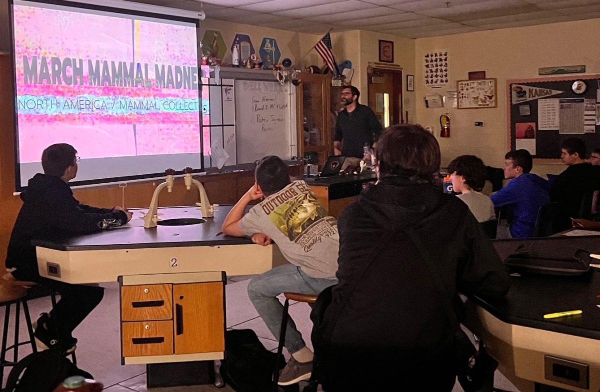 Stadalman&#8217;s seventh grade science class watches the video recap to see what species will move onto the &#8220;Elite Trait.&#8221; The final results will be presented Wednesday.