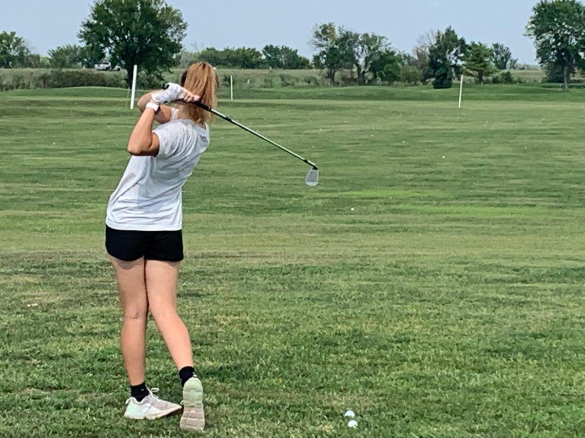 Junior golfer Joellen Vogt practices her mid-range game at the Twin Oaks Golf Complex.
