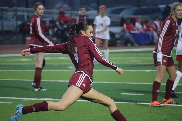 Jayla Erpelding takes a free kick in a 10-0 loss against Bishop Miege on Tuesday. 