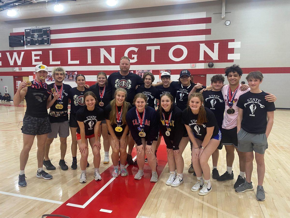 The Cardinal powerlifting team celebrates its wins at state with championship medals. Photo courtesy of Scott Russell.