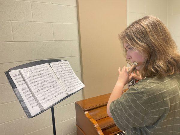 Senior Sophia Nichols, who has played flute since fifth grade, practices her flute solo. She said performing is exhilarating and earned a 2 rating at regionals.
