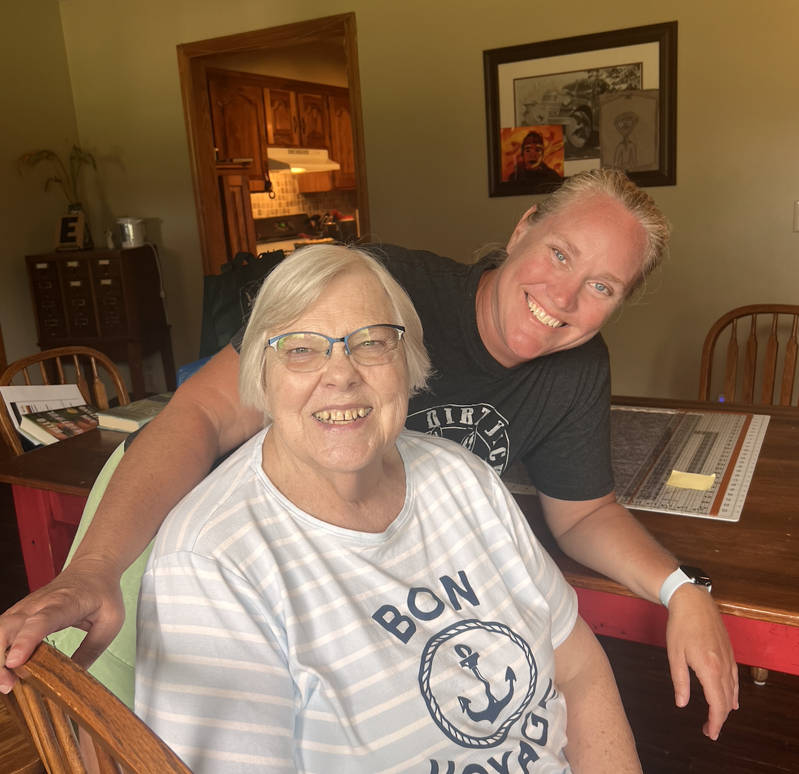 Gretchen Schreiner and Lois Epperson spend time together working on a quilt. Epperson has worked in the libraries for over 10 years with Schreiner.
