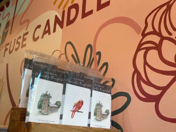 Jerry Ratway’s greeting cards with his original drawings on display at Fuse Candle Bar.