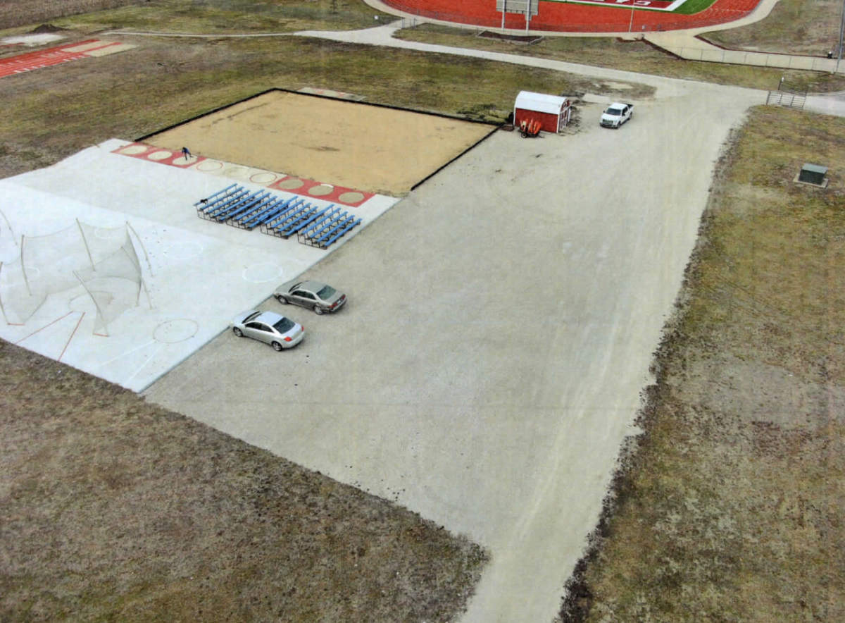 The extended parking lot sits near the football field and has historically been used for overflow parking. The gravel lot does not meet city regulations. Photo Courtesy Eudora School District.&#160;