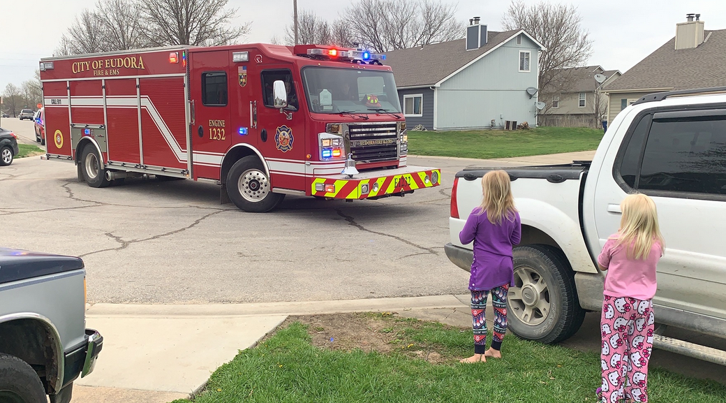 Tabby Alexander watches as the Eudora Fire Department arrives Monday to sing her happy birthday. She turned 9.