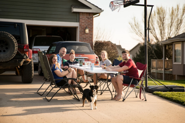 Angela Karten and her family eat dinner in their driveway as part of Eudora’s social distancing dinner.