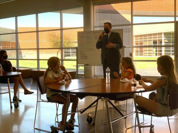 Stuart Moeckel, who serves as superintendent and principal for seventh through 12th grades at Madison Virgil Schools, visited with Eudora community members at a meet and greet Friday. 