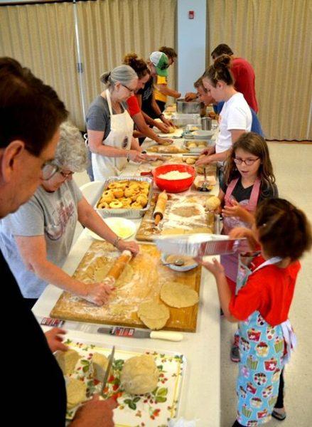 SUBMITTED PHOTO. This photo from earlier years making apple dumplings shows the process for getting the baked goods ready.