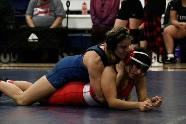 Junior co-captain Kambry Shockley takes down an opponent.