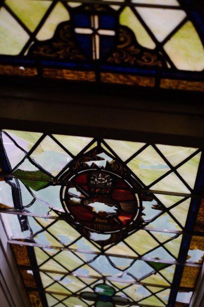 A handful of the church's windows have broken glass.
