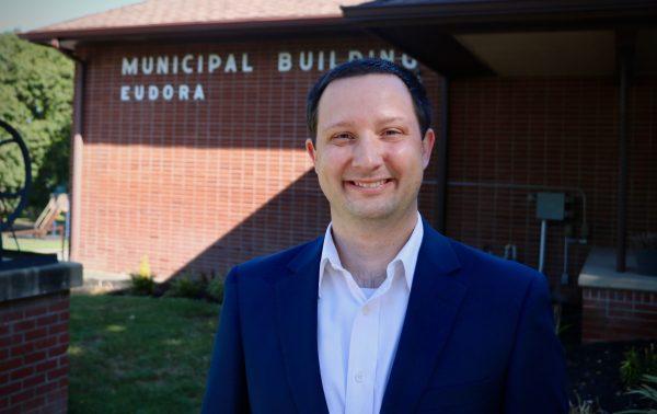 Alex Curnes stands in front of Eudora City Hall, where he was sworn into the City Commission in June.