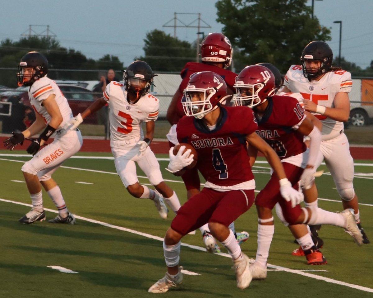 Junior Adrion Seals looks for blockers on a punt return against Bonner Springs. Seals had a couple of long punt returns during the game.