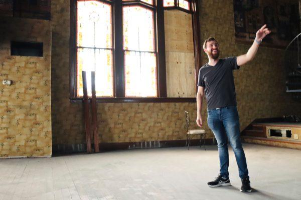 GW Weld points to the original stained glass designs inside the old United Methodist Church.