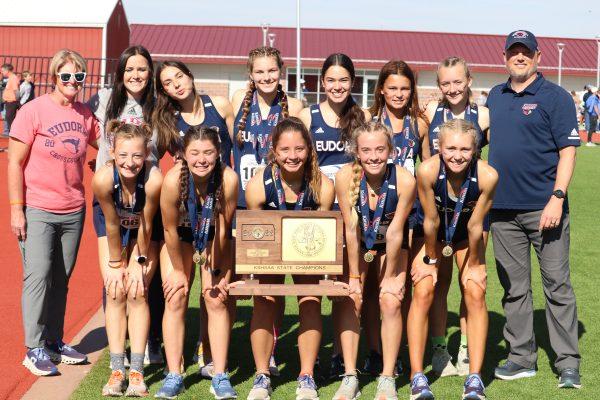 The girls’ team poses with their trophy after the awards ceremony.