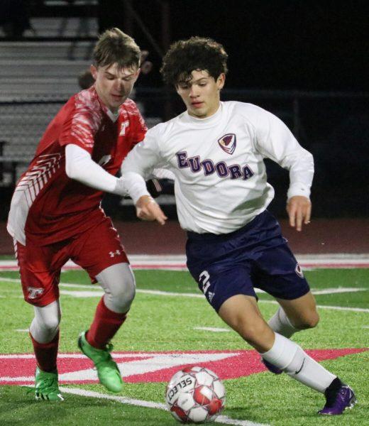 Junior forward Ayden Ramirez dribbles the ball up the field Monday night, looking to help break the scoring drought for the Cardinals.