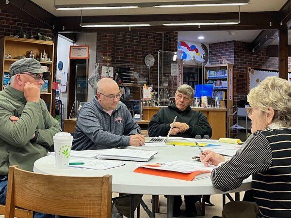 Library Board member Kenny Massey, President Eric Magette, Vice President Mike Keltner and Library Director Carol Wohlford discuss a community survey to determine why voters struck down a new library proposal last spring.