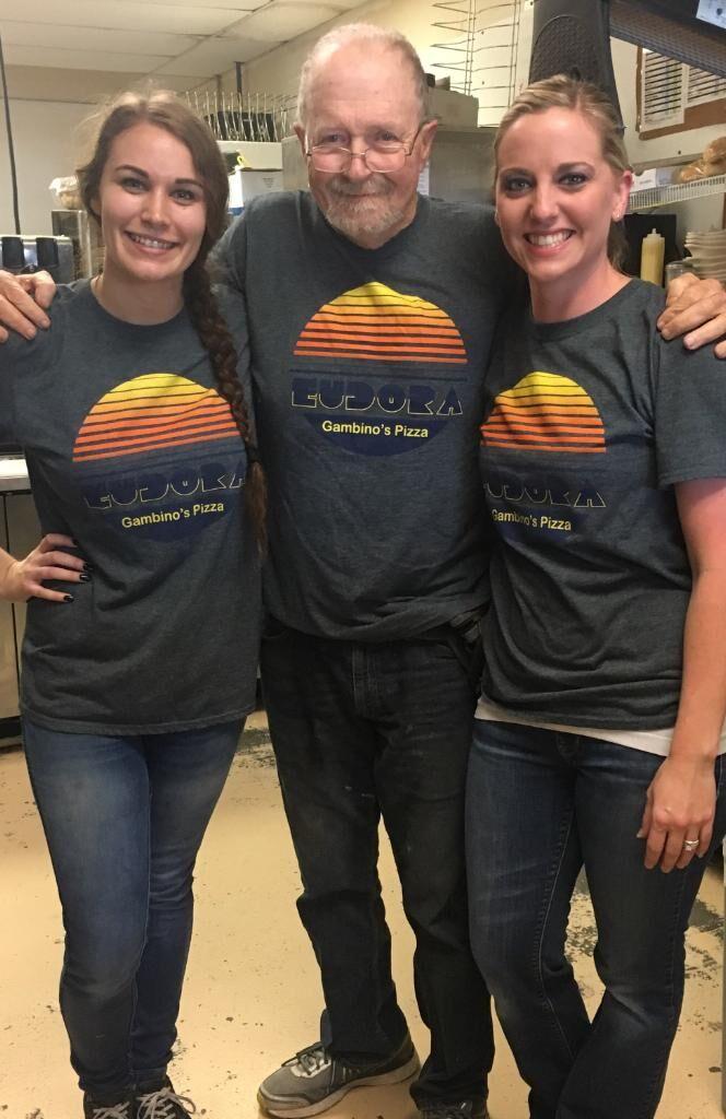 Jim Harris was a regular at Gambino&#8217;s. He became close with several of the employees, and even had a matching shirt. Elizabeth Thero, Harris and Sheena Boden pose in their shirts. Photo courtesy of Elizabeth Thero.