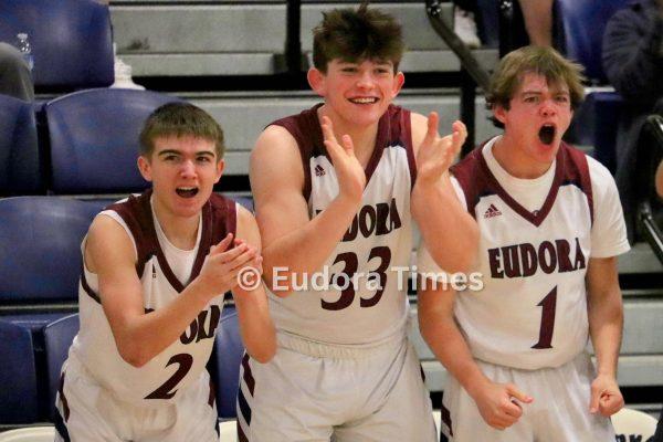 From left, junior Braydon Gardner, sophomore Cage Crabill and senior Jerry Coble cheer on their teammates Wednesday night against Parsons. Coble was one of two seniors ending their season as a Cardinal.