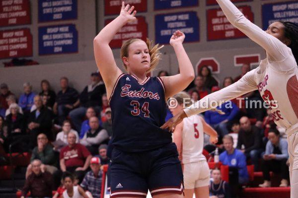Senior Lucy Giffin passes to a teammate against Bishop Miege on Friday Night. Giffin said she was proud of how the team had stuck together through high and low.