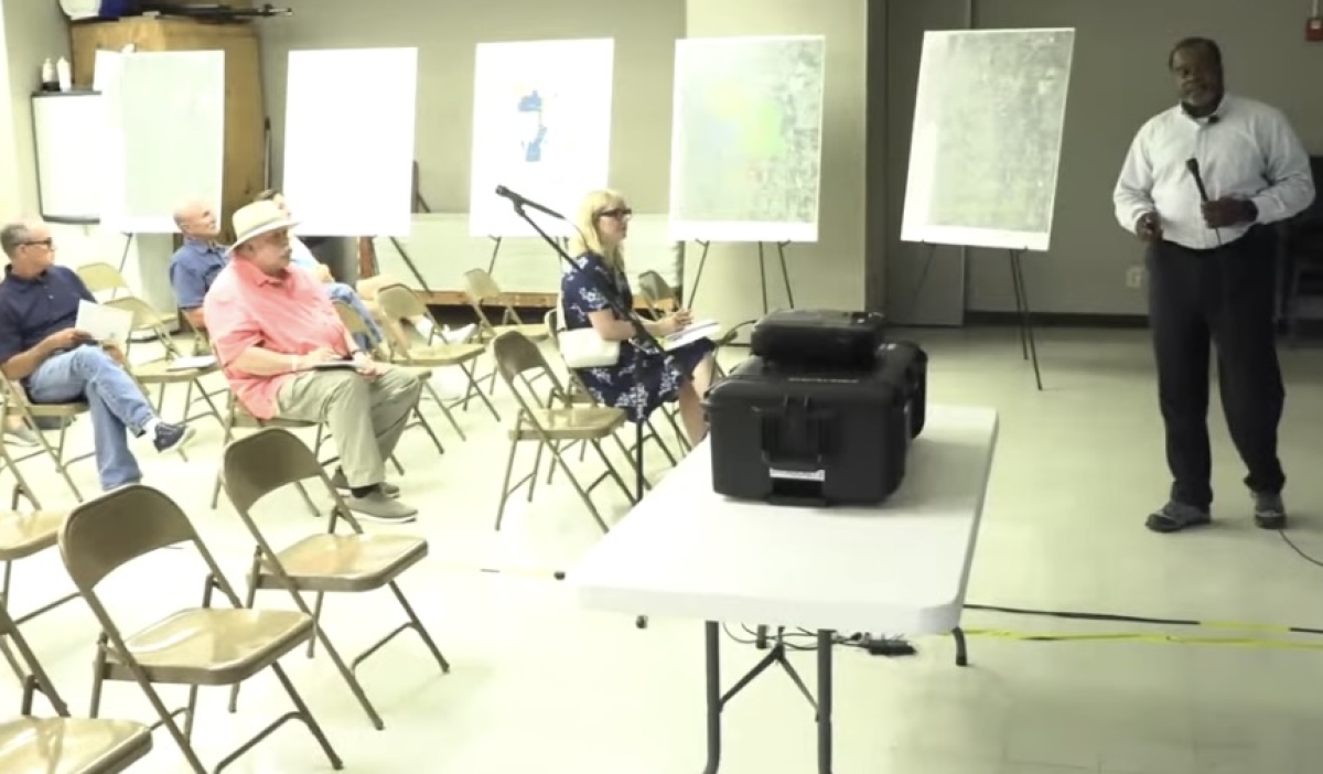 Community members gather for a public meeting Wednesday night to hear updates on clean-up efforts at the old Sunflower Ammunition Plant. It is still planned to be finished in 2028. This is a screen grab from a recording of the meeting.