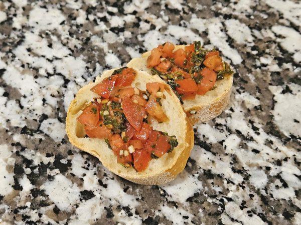 Bruschetta is a great summer appetizer, featuring tons of fresh flavors, from ripe tomatoes to bright basil and bursts of garlic.  