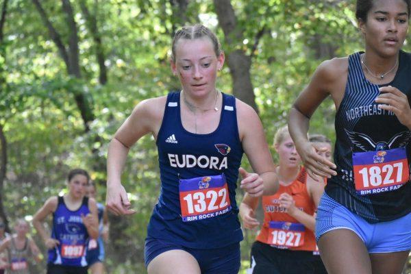 Junior Addie Williams pushes past runners at Rim Rock on Saturday. 