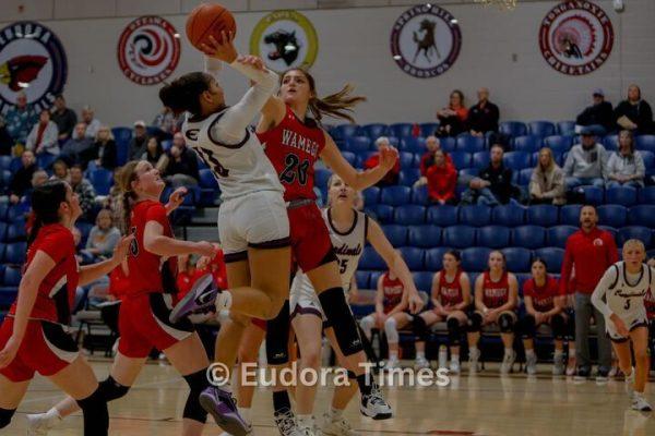 Freshman Avah Dye takes a shot during the Cardinals' home opener against Wamego on Tuesday. The Cardinals defeated the Raiders, 52-38.
 