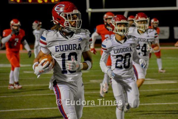 Senior Christian Jarrett returns an interception against Lansing on Nov. 1. His defensive skills earned him multiple all-state and all-league honors.