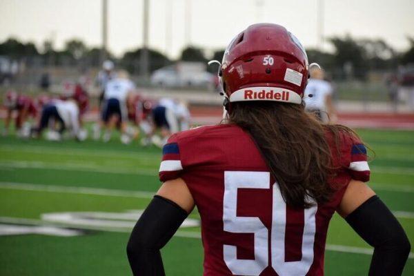 Senior Silvestre Janovec watches from the sideline during a football game this fall. Janovec says he watches one player at a time during games to pick up tips from them.  