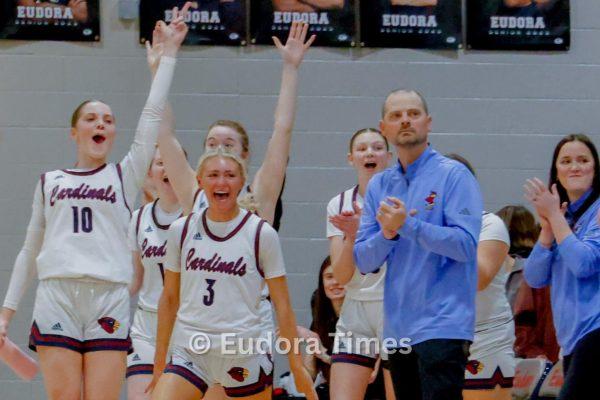 The Cardinals bench celebrates a teammate’s 3-pointer Friday night. Team chemistry has been key to the team’s strong start.