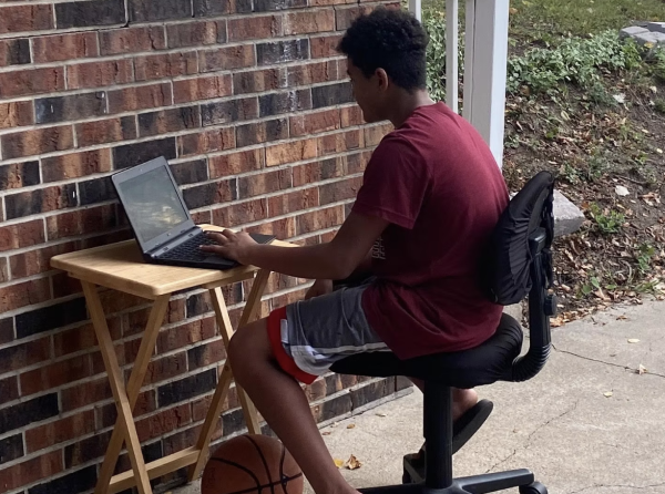 In this file photo from September 2020, Julian Oatis opts to do remote schooling outside. Educators have tried various strategies since the pandemic to get local students back on track in the classroom. 