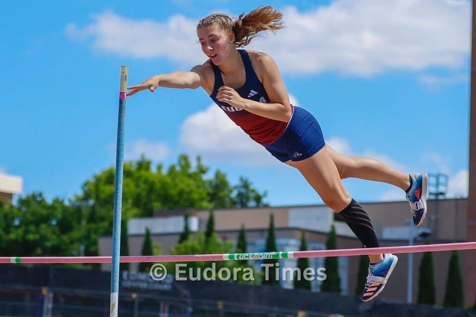 Sophomore Izzy Brunkow launches during the pole vault Friday at the track and field state championships. Brunkow won the pole vault state title. 
