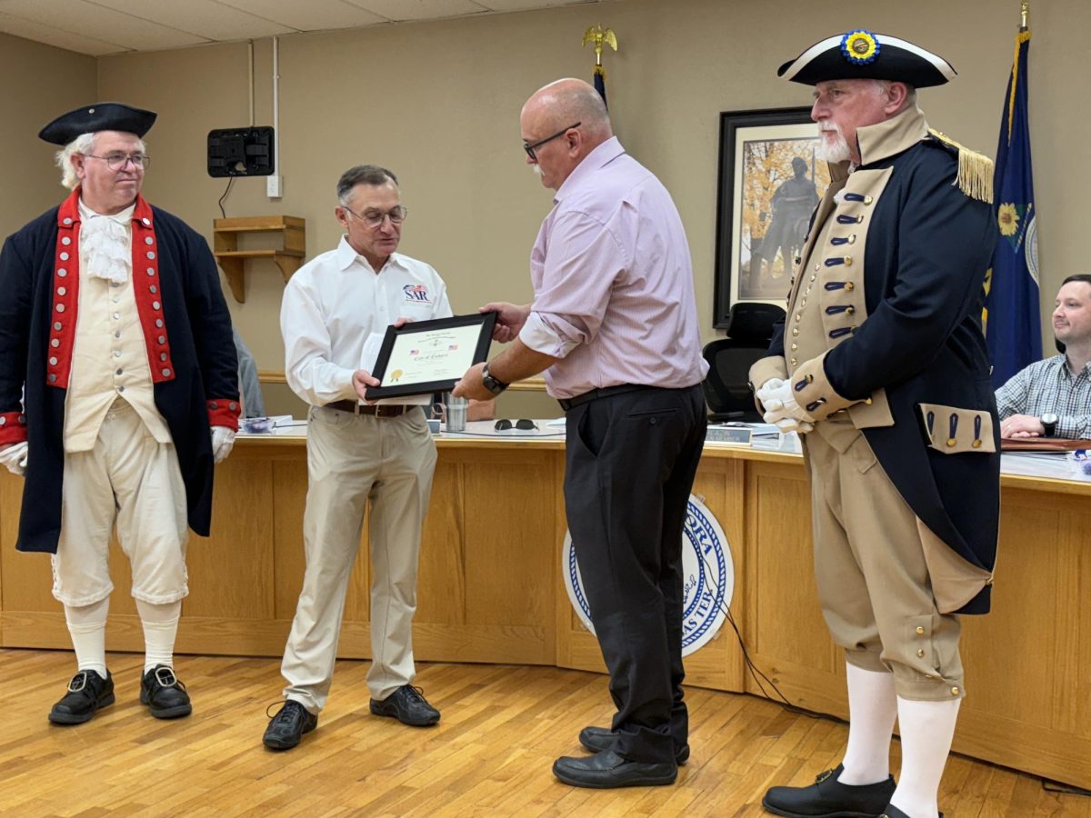 Peter Grassl with the Charles Robinson chapter of the Sons of the American Resolution presented the city with a certificate for its patriotism. The certificate was awarded due to the city’s flying of the American flag both outside City Hall and on Main Street, Grassl said. 
