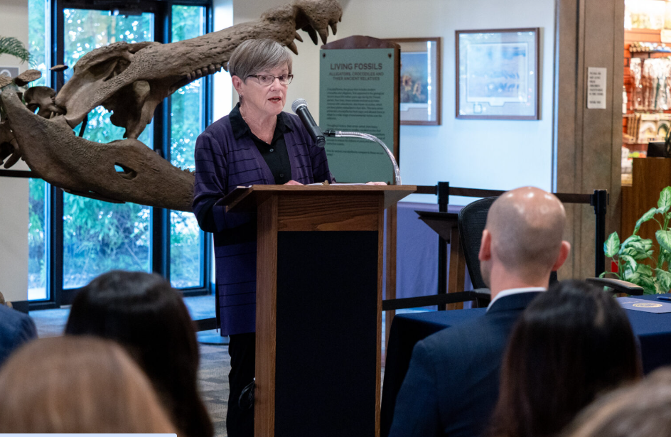 Gov. Laura Kelly addresses the crowd at a July 9, 2025, celebration of a new Water Plan Task Force at the Sternberg Museum of Natural History in Hays. (Sherman Smith/Kansas Reflector)
