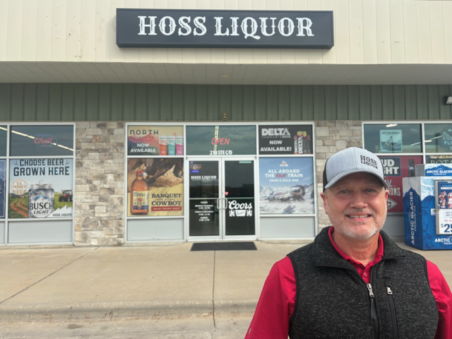 Lonny Ryburn stands in front of Hoss Liquor, the former location of Eudora Wine and Spirits.