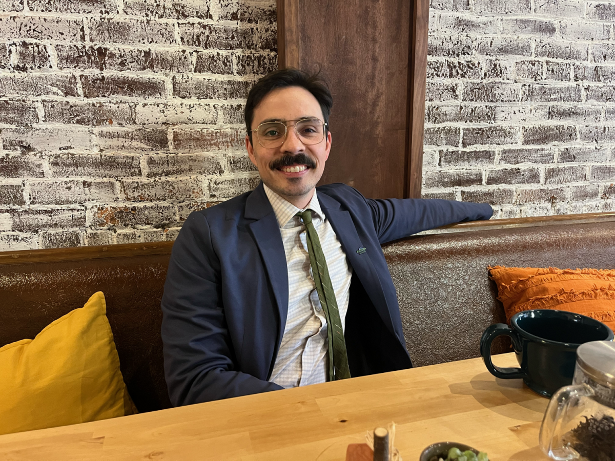 Incoming City Manager Zack Daniel sits at Zeb’s Coffeehouse for an interview Wednesday morning. 