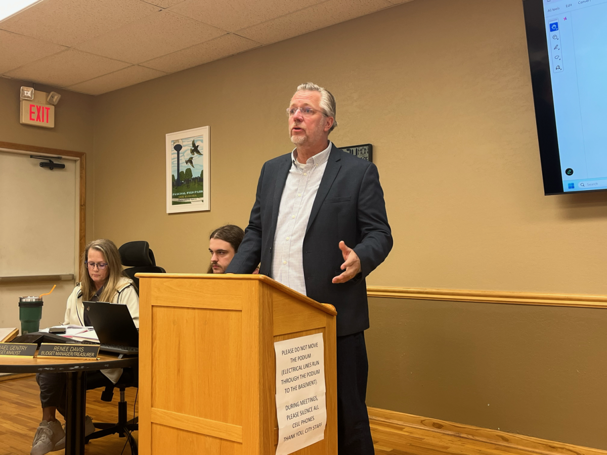 Developer Michel Borchardt speaks to city commissioners Monday. Borchardt is a Eudora resident hoping to fill out the remaining lots in the Nottingham Center with apartments, food and services.