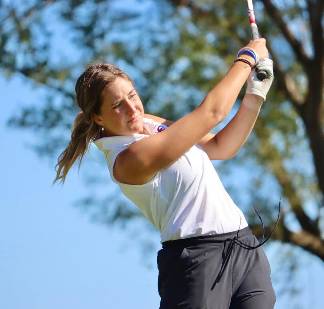 FILE PHOTO. Joellen Vogt hits a tee shot at regionals in Wamego on Oct. 9, 2023. Vogt qualified this year for the National Christian College Athletic Association Women’s Golf Championship.
