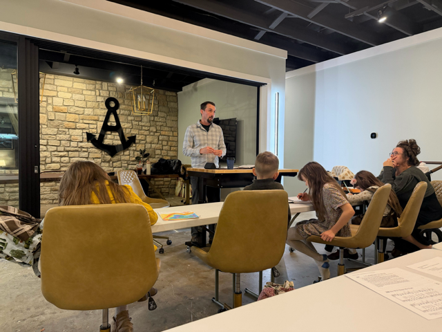 The Rev. Dustin Anderson leads a group in Bible study at Anchored Collective on Thursday, Nov 20.