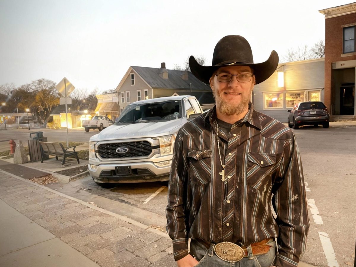 Ty Blessing stands on Main Street. Blessing just wrapped up a successful rodeo season on the Prairie Circuit. 