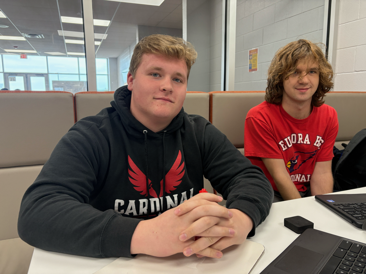 The first phone of Cooper Gray, pictured left, was a flip phone. He said it was good because he didn’t have any distractions. He has a new phone now, though. Henry Elmer, right, got his first phone when he was 13. He said his use was unrestricted, but it didn’t cause him any problems.