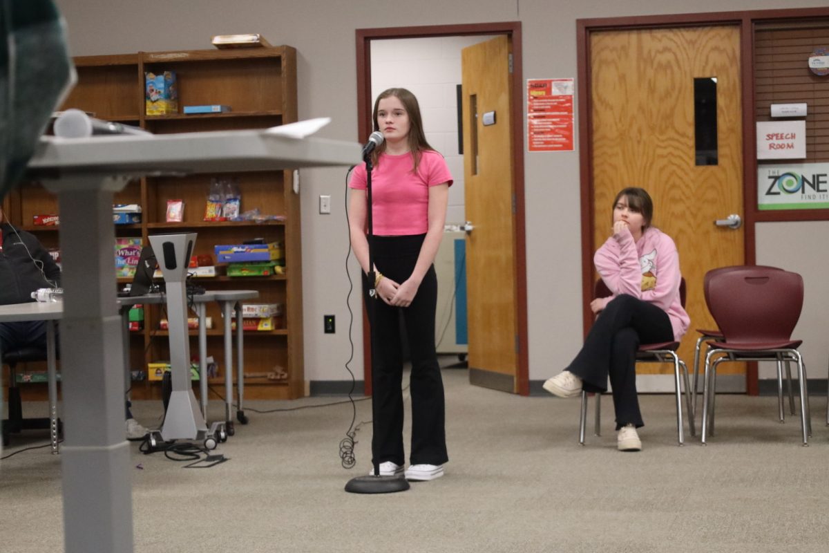 Sixth graders Myra Gurney and Canela Chacon compete in the final round of the spelling bee. 