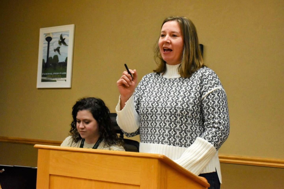 Joy Rhea, a landscape architect with McClure, presents to Board of Zoning Appeals members Thursday night about planned apartments north of K-10. Board members approved a variance to allow the project to move forward with fewer parking spaces than required by city code.