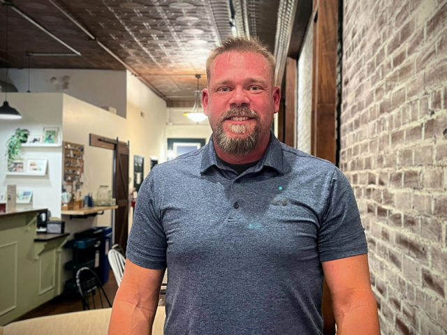 New Mayor Tim Bruce stands at Zeb’s Coffeehouse for an interview Tuesday evening.