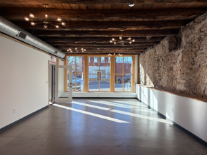 The Gathering Place will be furnished with 10 round tables and 60 black chairs. It will also have a 7.2-foot wooden arch for pictures and two bar tables for food service. White tablecloths and a 3-tier cooling table will be available as add-ons.