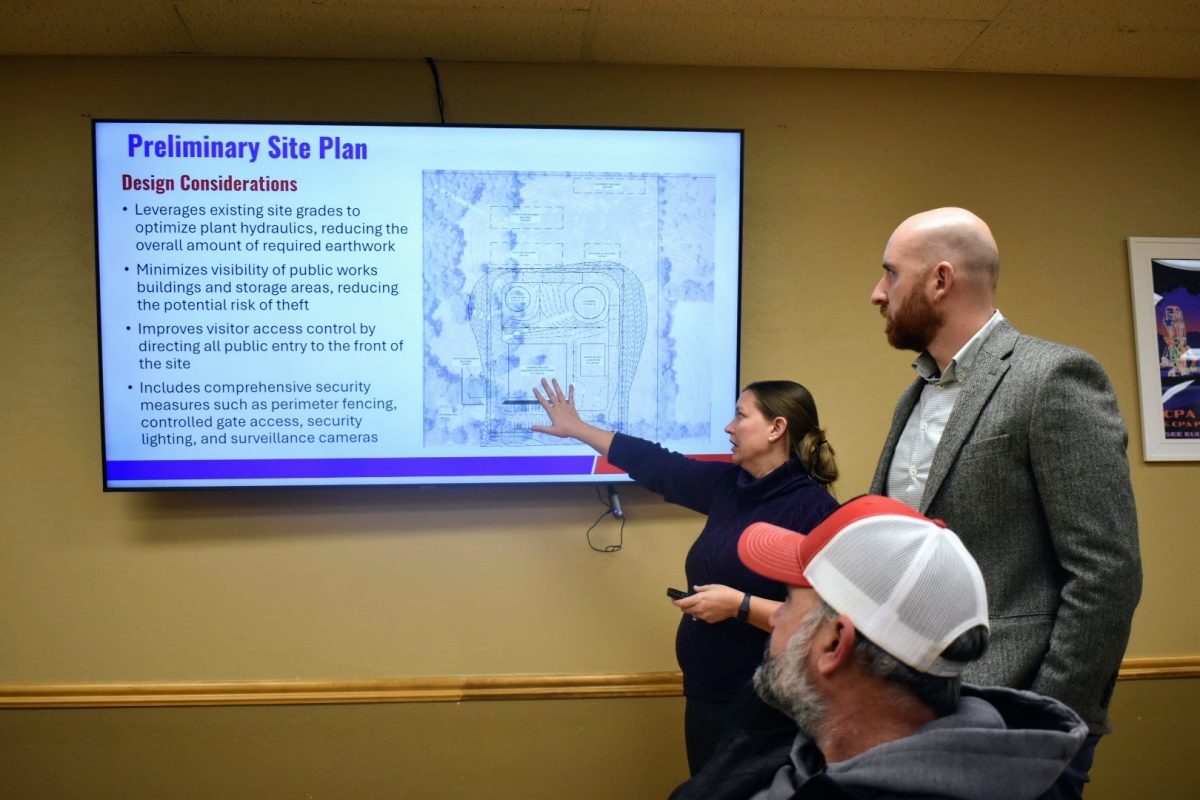 Dana Hinderliter of Burns and McDonnell and Ryan Rutkowski of CAS Constructors speak to city commissioners Monday about the next phase of construction for the new $1.2 million water treatment plant. 