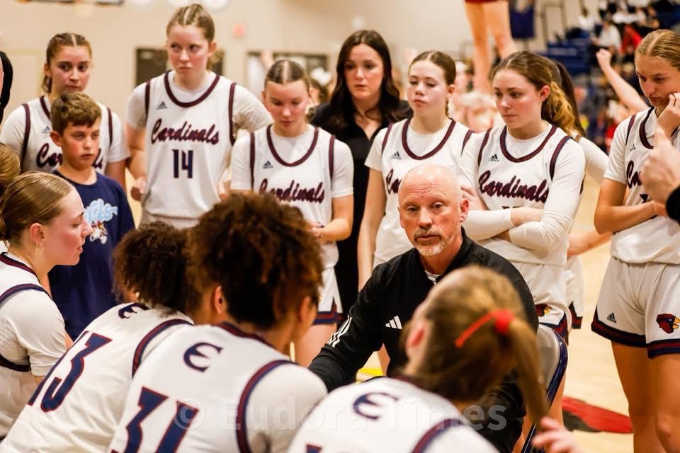 Girls basketball coach Brandon Parker huddles with the team during their win over Ottawa Friday night. 