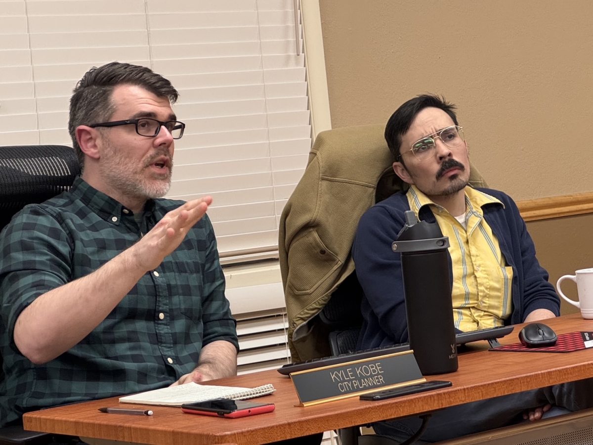 City Planner Kyle Kobe, left, discusses a Planning Commission orientation next to City Manager Zack Daniel at the Planning Commission meeting Wednesday night. 