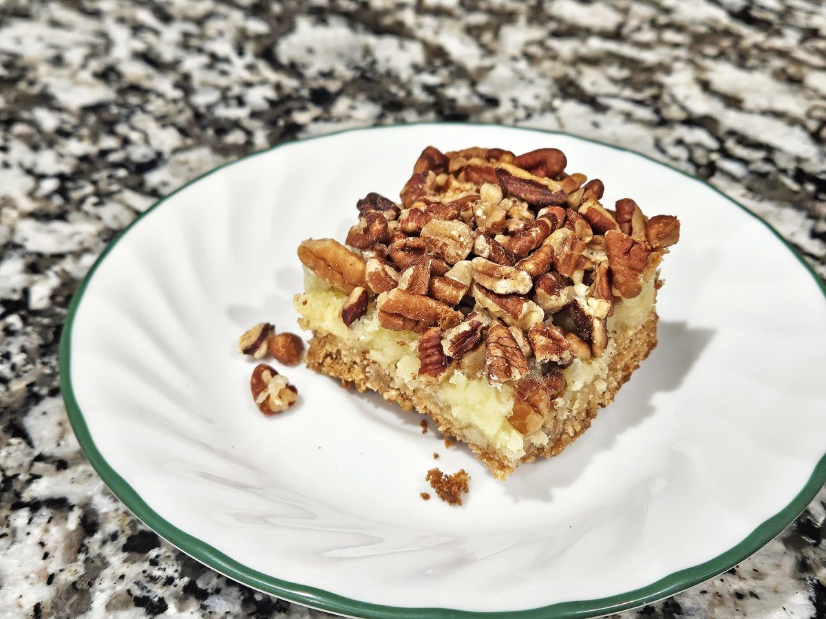 Butter pecan bars are made with a secret ingredient—a cake mix—making them super easy to put together while being a delicious addition to any dessert table.